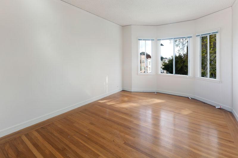 Empty room with wood floors